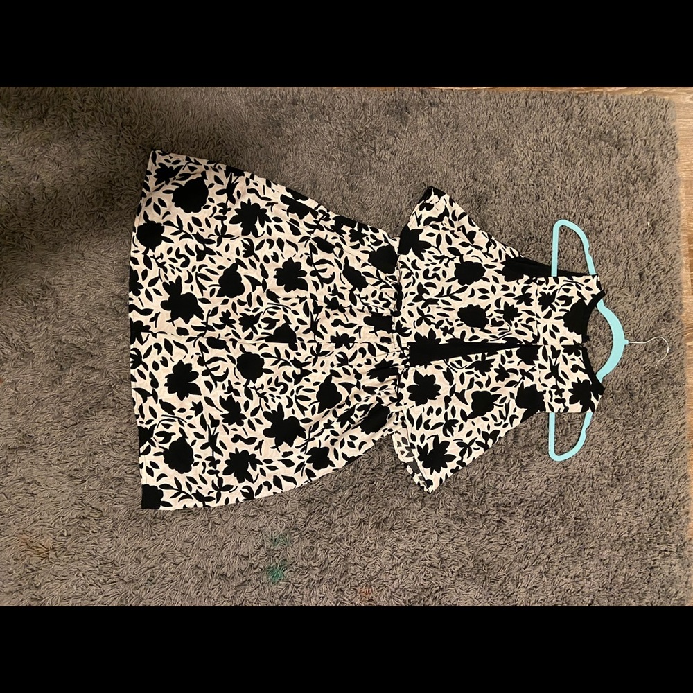 Midi dress that is black, white, and light pink. Good for formal occasion.